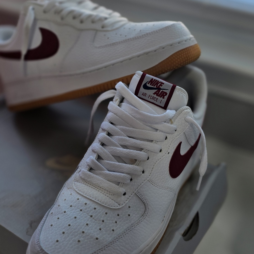 Nike Air Force 1 White Sneakers with Maroon Swoosh and Gum Sole